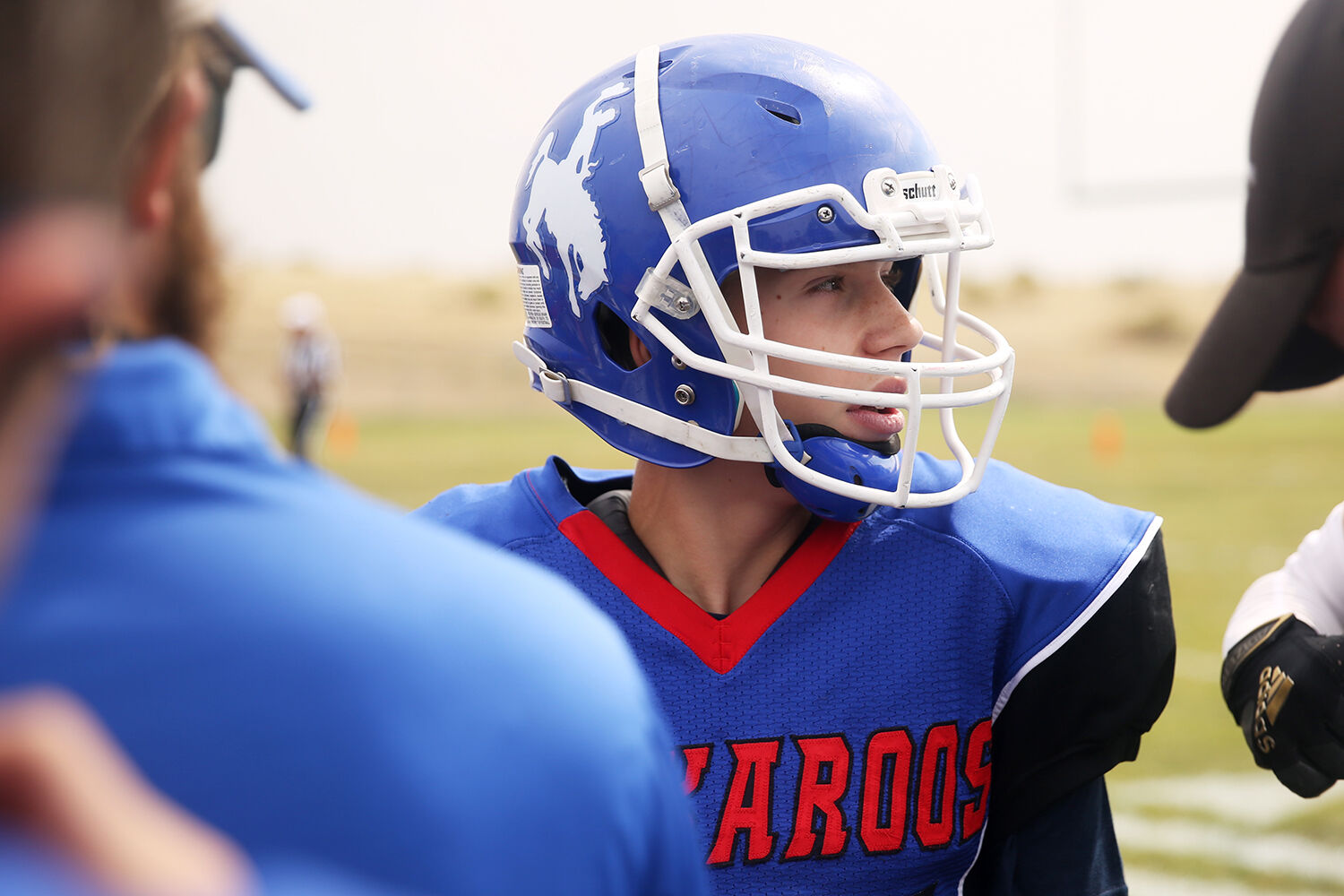 Damien Cohee looks to his teammate during a huddle